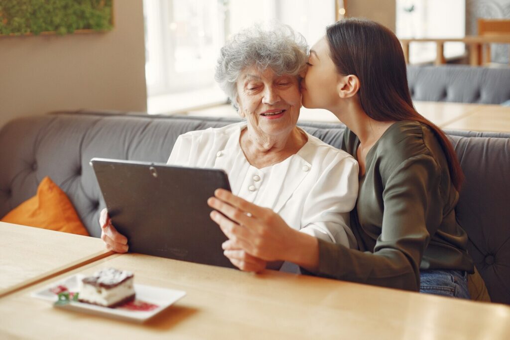 Elderly woman reviewing health records securely on blockchain-enabled tablet
